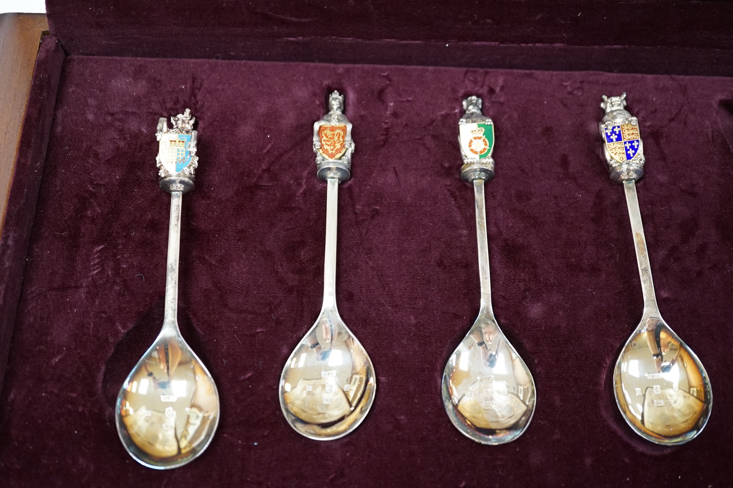 A modern limited edition cased set of ten silver and enamel 'The Queens Beasts Spoons', by Toye, Kenning & Spencer, no. 345/2500.